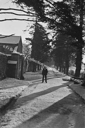 SNOW SCENE ON ROAD OUTSIDE FARM